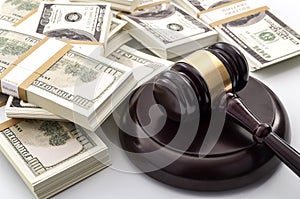 Money influence in the legal court system, corruption, auction bidding and bankruptcy conceptual idea with wood judge gavel and