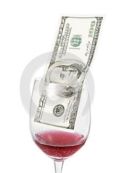 Money inside wine glass