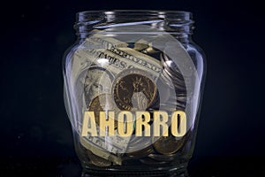 Money jar with AHORRO text photo