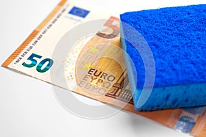 Money laundering concept. Criminal cleaning euro banknotes