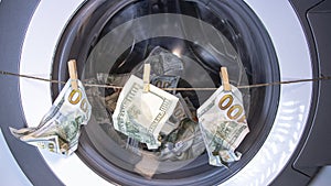 Money laundering. Corruption Concealment of taxes. Dollars in the drum of a washing machine