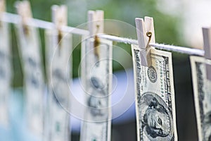 Money Laundering. Money Laundering US dollars hung out to dry. 100 dollar bills hanging on clotheslines