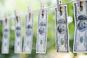 Money Laundering. Money Laundering US dollars hung out to dry. 100 dollar bills hanging on clotheslines