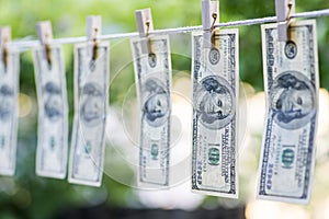 Money Laundering. Money Laundering US dollars hung out to dry. 100 dollar bills hanging on clotheslines