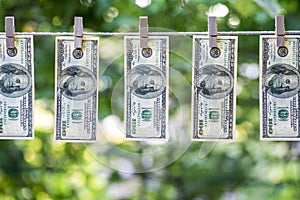 Money Laundering. Money Laundering US dollars hung out to dry. 100 dollar bills hanging on clotheslines