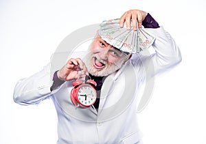 Money. mature man with beard hold money. clock show time. time is money. time management. business success. retirement