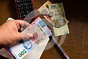 Money - Mexican pesos, making a budget photo