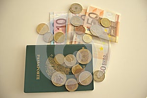 Money notes, green passport and coins