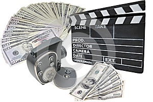 Money, old movie camera and clapperboard on a whit