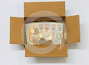 Money in a cardboard box