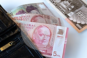 Paraguay banknotes, Guaranies sticking out of the wallet photo