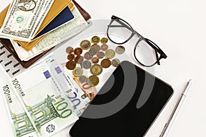 money pen paper tablet and glasses on white background, calculating budget, currency balance, travel concept