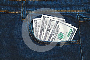 Money in the pocket of blue jeans