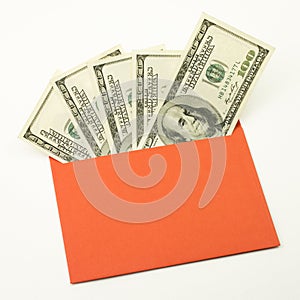 Money in red envelope. One hundred bills. Unofficial salary. Fan of dollars