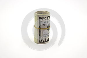 Money. Roll of dollars isolated on white background.