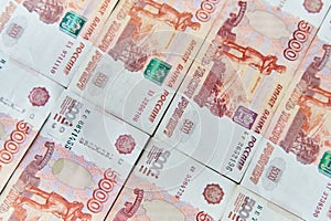 Money on Russia. Close-up of Russian rubles on five thousand and one thousand banknotes. Finance concept.