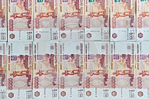 Money on Russia. Close-up of Russian rubles on five thousand and one thousand banknotes. Finance concept.