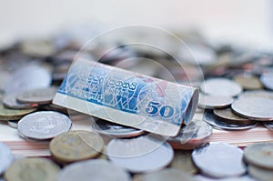 Money Sri Lankan  Fifty ruppee bill and asorted coins  on white background