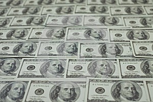 money stack of 100 US dollars banknotes a lot of is arranged in a beautiful, selective focus