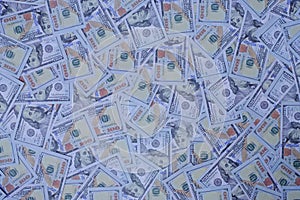 money stack of 100 US dollars banknotes a lot of the background texture top view