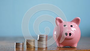 Money stack pile step growing money and piggy bank. Concept savings with piggy bank and stacked coins. Piggy bank