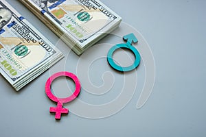 Money and symbols as gender inequality or pay gap.