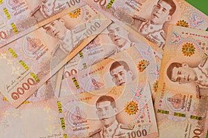 money, Thai banknotes, cash flow, investing and financial planning and returns on stock investments