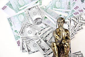 Money and Thinking Man Statue