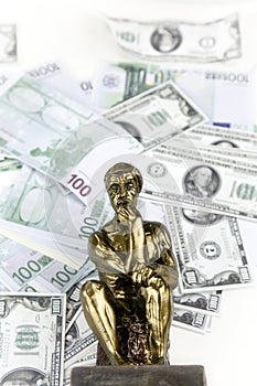 Money and Thinking Man Statue