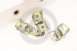 Money is thrown away in the sink. This photo concept illustrates the financial condition of a business that is failing