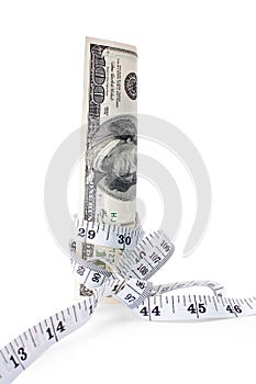 Money tied with measuring tape