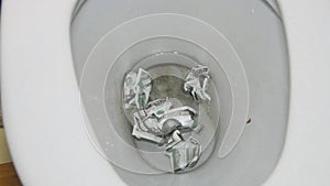 The money to flush with a stream of water in a dirty toilet
