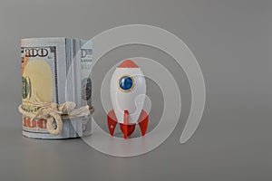 Money and toy rocket. In the realm of startup business, the perfect blend of financial resources and a rocket-speed network