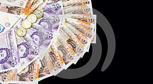 Money of United Kingdom close up on black background. Pounds UK 10 and 20 note
