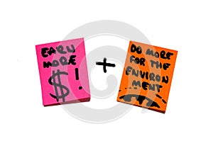 Money, wealth, economy versus environment, earth, responsibility. post it notes.