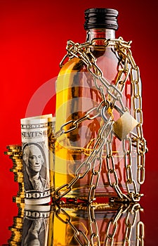 Money and whisky bottle