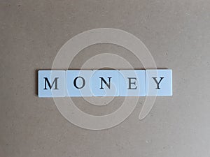 The Money word on wooden floor concept background