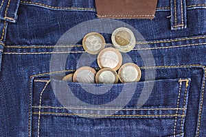 Money in your pocket. Coins in pocket jeans. The concept of pocket money. Cash. Business concept