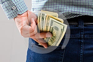 Money in your pocket. money in hands photo