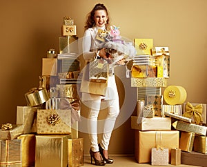 Monger holding pile of recently bought products for family