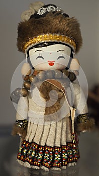 Mongol traditional doll traditional clothes upright closeup