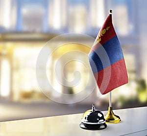 Mongolia flag on the reception desk in the lobby of the hotel photo