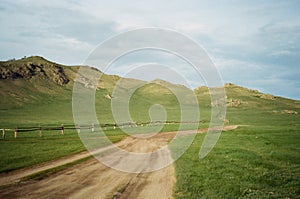 Mongolia Landscape: desertic green road photo