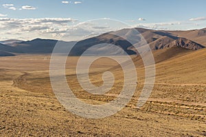 Mongolia landscape with nomad yurts in Altai. Mongolian nomad on a motorcycle