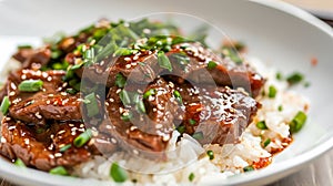 Mongolian beef with sweet and savory spicy soy sauce and garlic glaze served on rice. Popular Asian dish