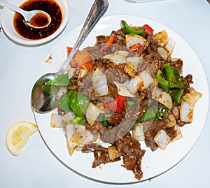 Mongolian beef in a white plate