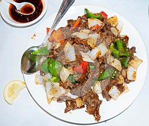 Mongolian beef in a white plate