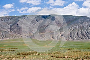 Mongolian mountain natural landscapes with eroded foothill slope