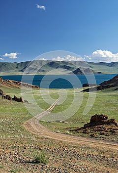 Mongolian natural landscapes with country road to the lake Tolbo-Nuur in north Mongolia