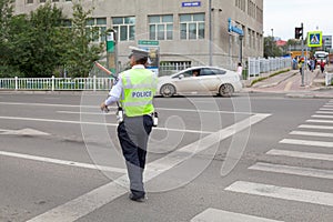 Mongolian policeman doing traffic in Ulaanbataar